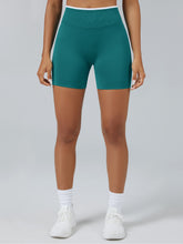 Personalized seamless athletic shorts with custom branding in teal