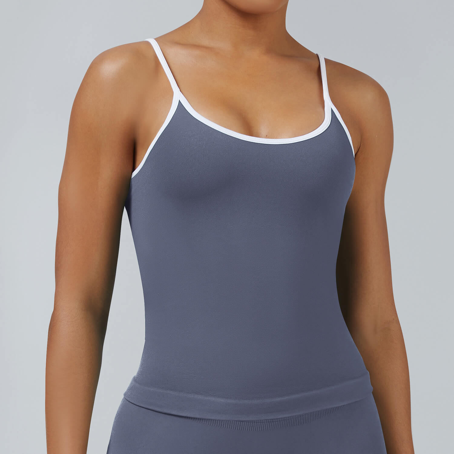 Ash grey seamless cami tank with removable pads and white contrast trim, breathable athletic top for sports and fitness activities
